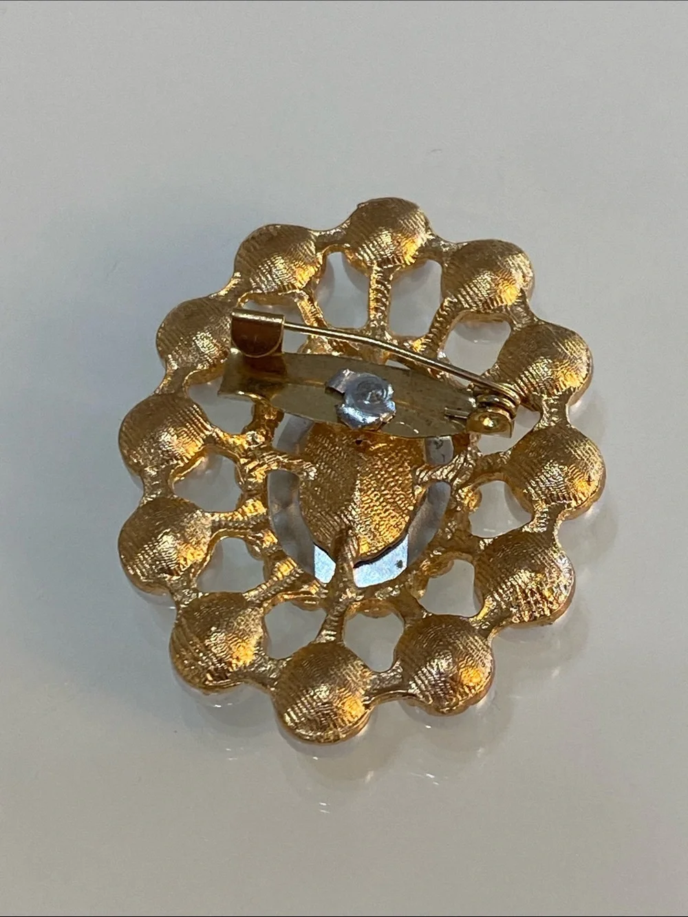 Faux pearl brooch